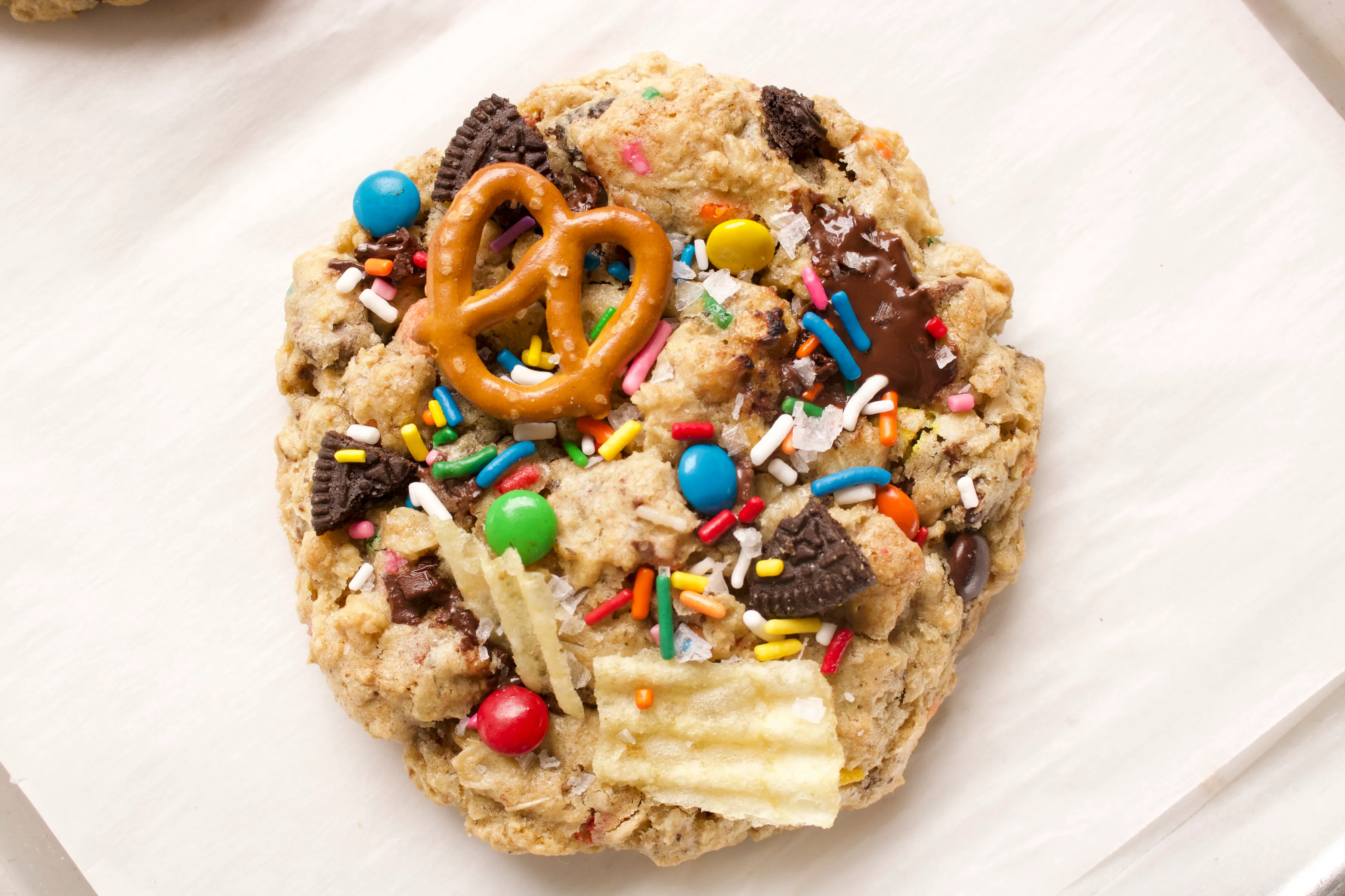 Alex's kitchen sink cookie loaded with sprinkles, pretzels, chips, and candy.